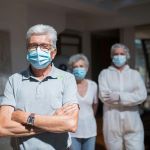 Image of 3 elderly adults wearing masks