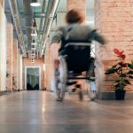 Person in a wheel chair appearing to go fast