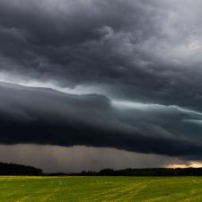 Image of a thunderstorm over a field