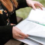 Woman looking at documentation